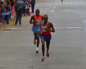 Geoffrey Mutai Pulls away from Stanley Biwott just before mile 23