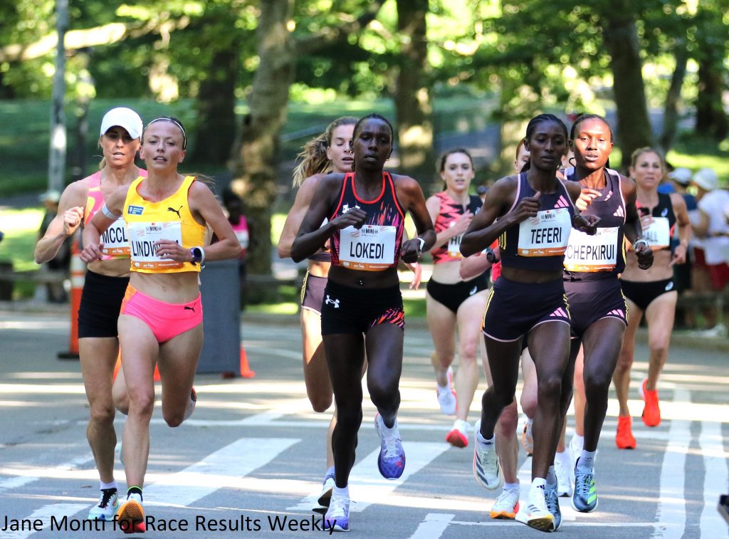 The lead pack of the 2024 Mastercard New York Mini 10-K at the two-mile point (left to right): Jessica McClain, Dakotah Lindwurm, Emily Durgin (obscured), Sharon Lokedi, Emma Grace Hurley (slightly behind), Senbere Teferi, Sheila Chepkirui, and Sara Hall (slightly behind). (Photo by Jane Monti for Race Results Weekly)